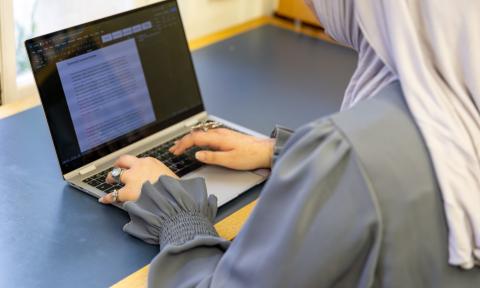 Student using a laptop. 